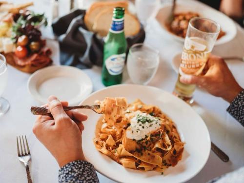 Person eating Pasta