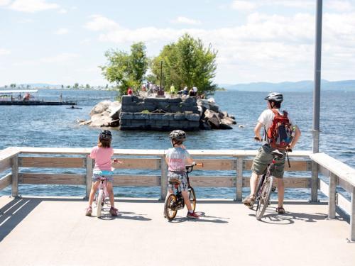 Three people waiting for the Local Motion bike ferry