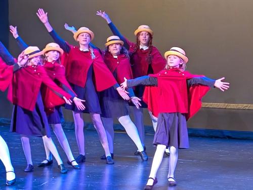 Holiday performance of Madeline's Christmas showing youth performing a musical number.