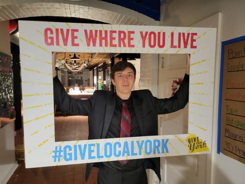 Jay holding GLY sign