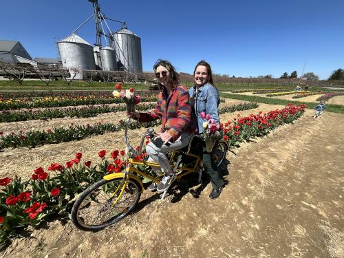 two people posing on the prop bike at Flinchbaugh's Tulip Field