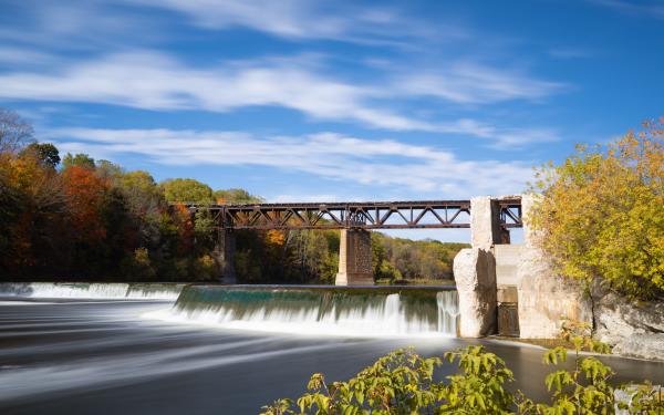 A photo of a waterfall under a bridge in Ontario, Canada.