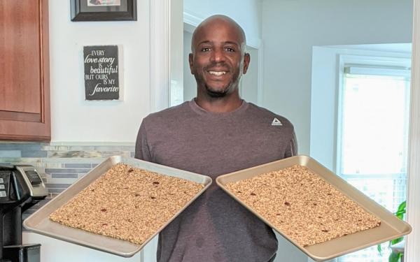 Man Holding Fresh Granola Bars From All Good Granola Bars In Virginia Beach, VA