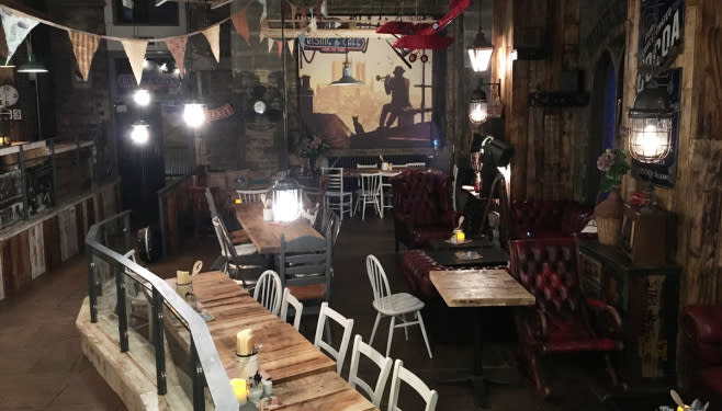 A dimly lit interior view of Rising Café
