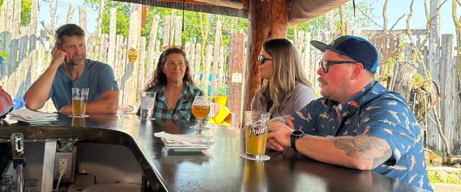 Friends drinking a beer at Sconni's