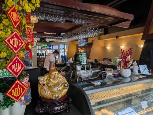 Inside of Pho Village Woodbury showing bar area with highlighted by festive restaurant decor.