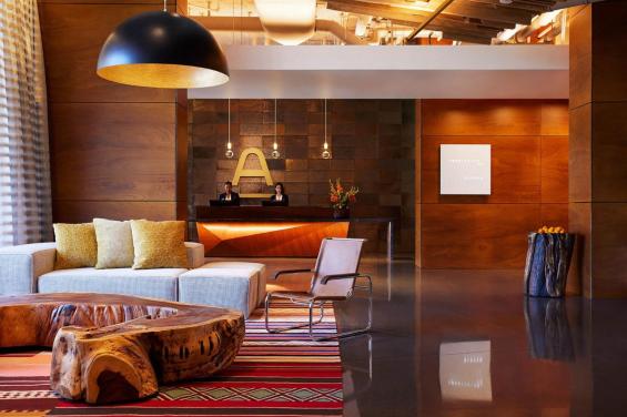 Lobby with couch and table - The Ameswell Hotel