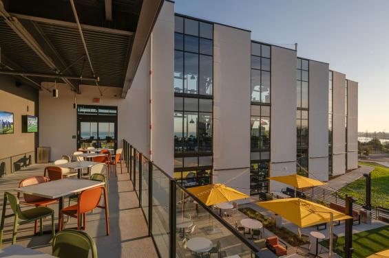 Outside tables and umbrellas - Topgolf Burlingame