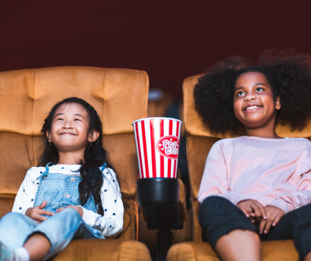 Two children watching a movie