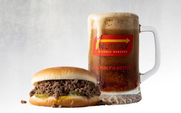 A crumbly NuWay burger is pictured next to a mug of ice-cold rootbeer