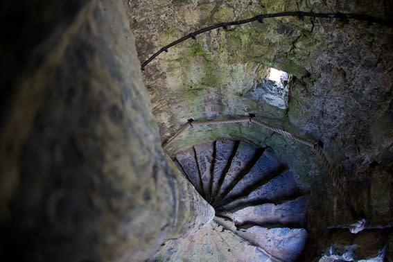 Stone spiral stairwell inside Oystermouth Castle