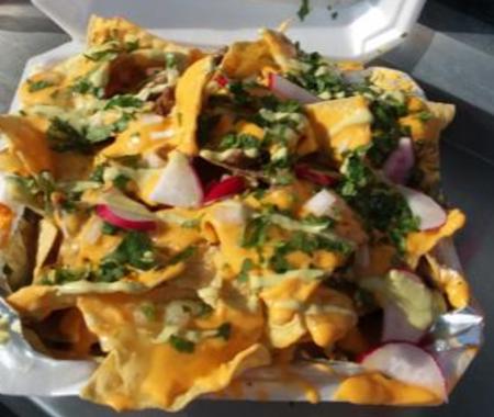 carryout container of nachos smothered with cheese from lita's tacos in florence ky