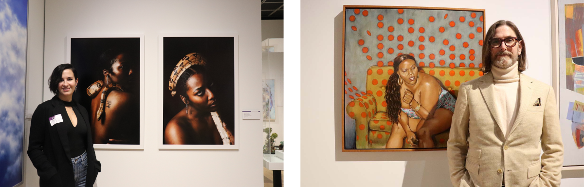 Artist Tryst Reid standing between two framed portraits Muskegon Museum of Art, smiling at the camera. The photographs feature close-up portraits of individuals adorned with cultural accessories. Artist Bryan Hoffman stands next to a large painting featuring a seated figure against a background with orange polka dots. The painting is colorful and expressive.