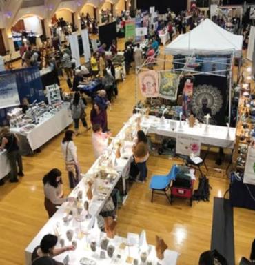Overhead shot of a few of the Spirit Fest vendors. Spirit Fest, featuring the Wisdom of Light Conference, comes to Punta Gorda in August of 2025.
