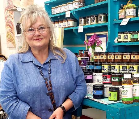 Donna Collins in front of a shelf at her Jelly Queens store