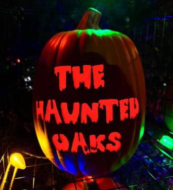 Carved pumpkin with words, "The Haunted Oaks" pertaining to neighborhood Halloween event in Woodbury.