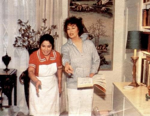 Carmen Vargas and Ava Gardner both pointing toward something in her London apartment