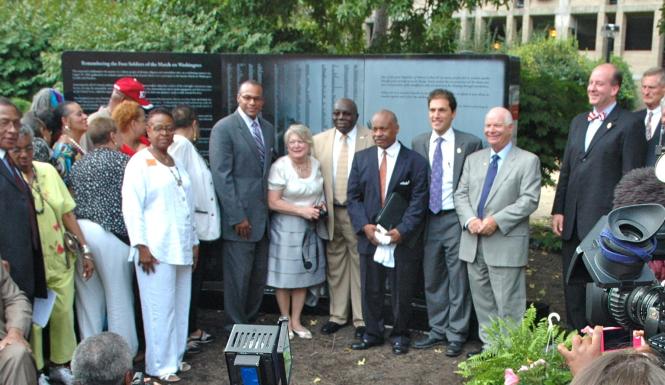 Ribbon cutting ceremony with Carl Snowden and Foot Soldiers.