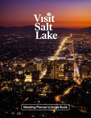 Sunset overhead view of the Salt Lake Skyline with the words Visit Salt Lake and Meeting Planner's Guide Book