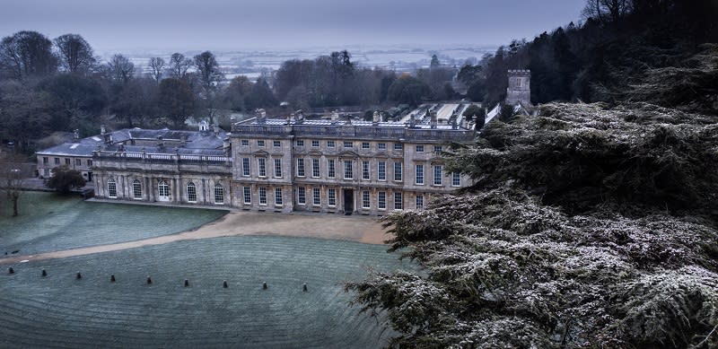 The impressive Dyrham House surrounded by frost covered grounds