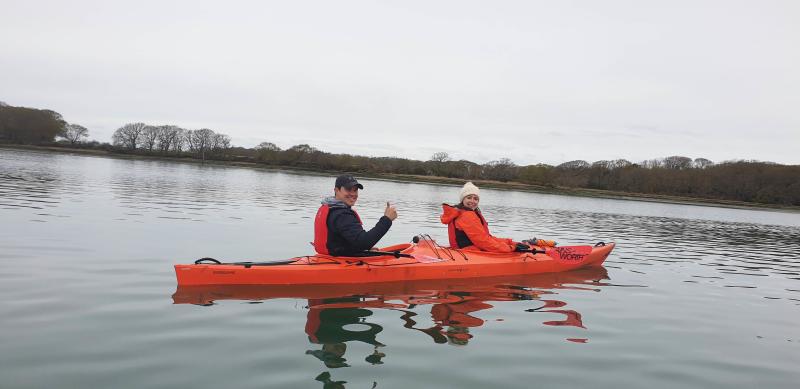 two people on a kayak in Chichester Harbour