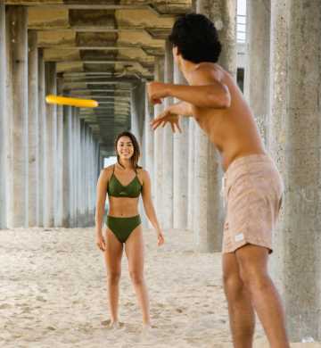 Couple Playing Freeze Bees in Huntington Beach