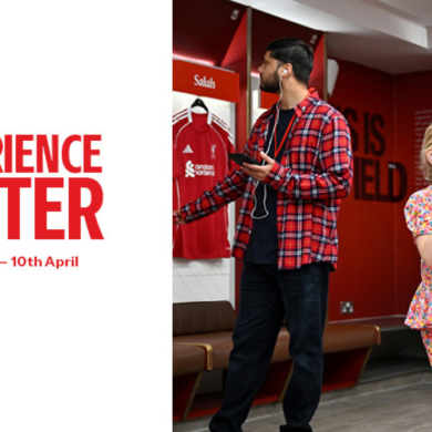 A promotional graphic showing the text “Experience Easter – 29th March to 10th April” on the left. On the right, an adult and a child stand inside a football locker room with red team shirts hanging behind them. Both are holding handheld audio guide devices.