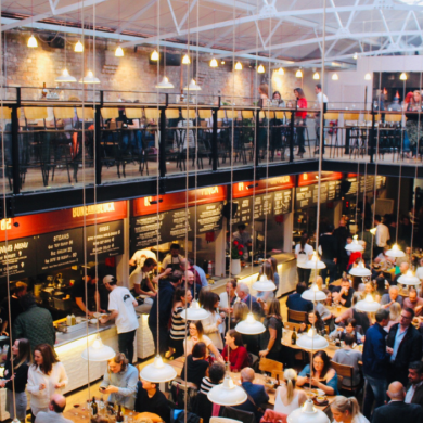 People chatting and eating in Duke Street Food and Drink Market