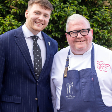 Harry and Paul Askew standing side by side, smiling