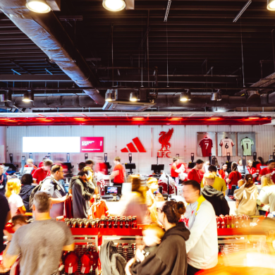 A slightly blurry image of people queing in the LFC shop