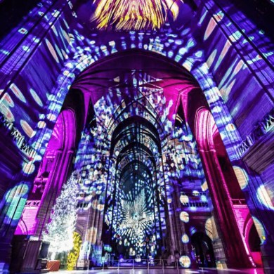 Inside Liverpool Cathedral with a light projection show.