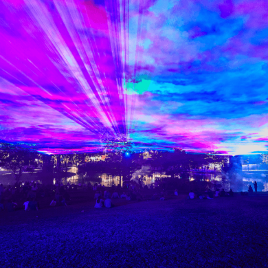 A light installation that looks like a night sky with blue and pink lights.