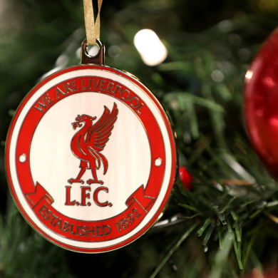 A Christmas bauble on a tree with a Liver bird, a red outline and the words 'We are Liverpool' around it.