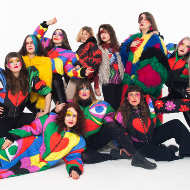 A group of people dressed in colourful clothing.