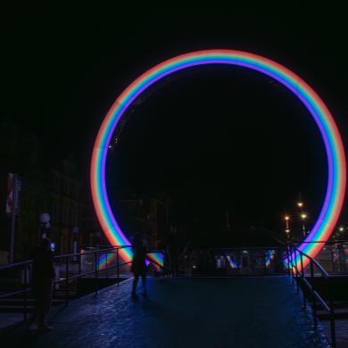 Image shows ARC installation from Lightport - a 10ft rainbow archway on Lord Street