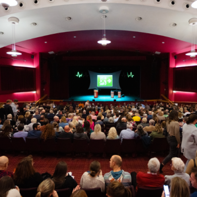 A conference takes place inside the Floral Pavilion
