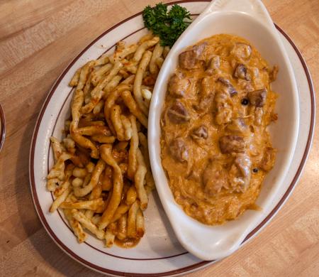 Image of a plate of goulash and spatzel from Jagerhaus