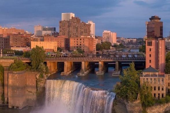 Rochester High Falls Rochester's High Falls surrounded by the city at sunset