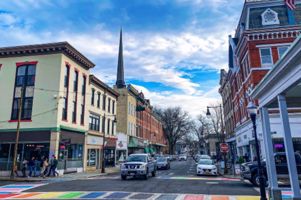 Kingston Rainbow and trans colored crosswalks on a street in Kingston