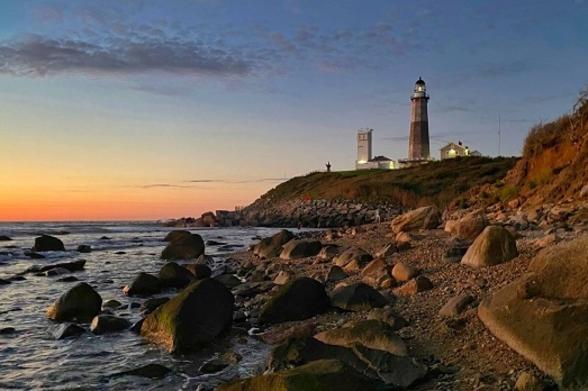 Montauk Point Lighthouse Montauk Point Lighthouse seen at dawn as the sky glows orange