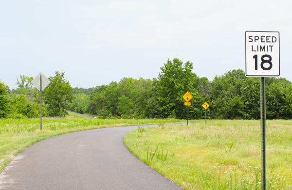 A wide shot of a winding paved trail in Chaffee Crossing on a cloudy day.