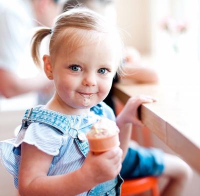 Little girl eating Jeni's Ice Cream Cone