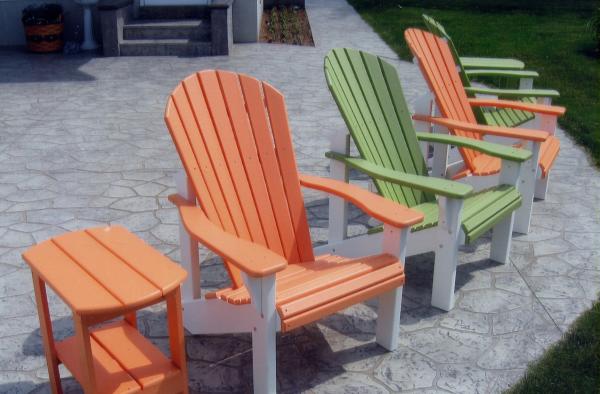 Orange and Green painted chairs and table from B&L Woodcraft on a decorative concrete patio