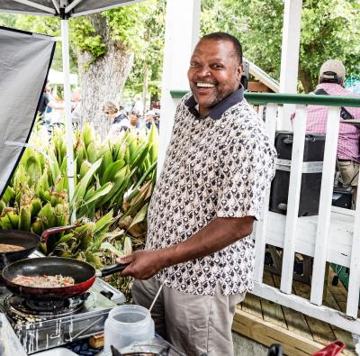 Man cooking at the Covington Farmers Market