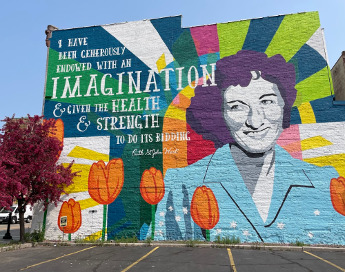 Ruth West Imagination Mural in downtown Manitowoc Wisconsin with pink tree