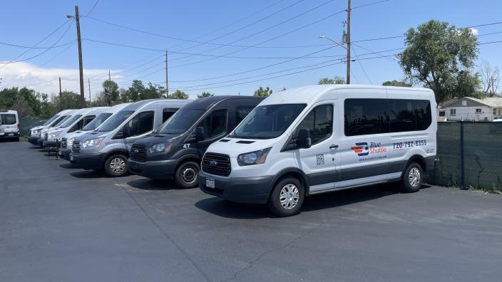 Blue vans shuttle top