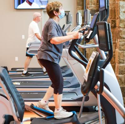 Seniors on fitness equipment