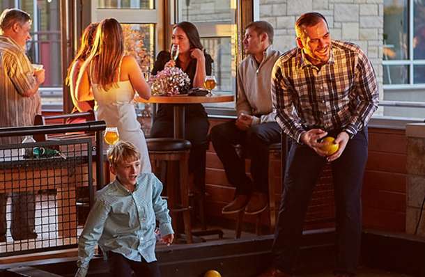 Playing bocce on the heated patio at Pinstripes