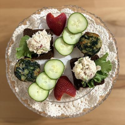 a plate of finger sandwiches at Front Porch Tea Room