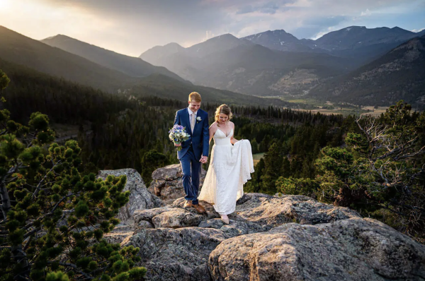 Picture of a couple taking a picture after their wedding in Rocky Mountain National Park